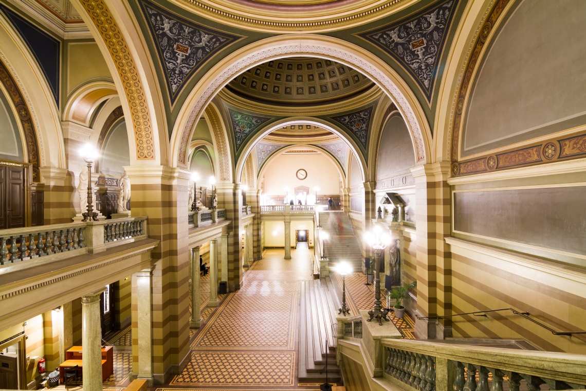 Interieur of the foyer of Uppsala University Main building. A magnificent hallway with ceiling arcs and marble floor. Photo.